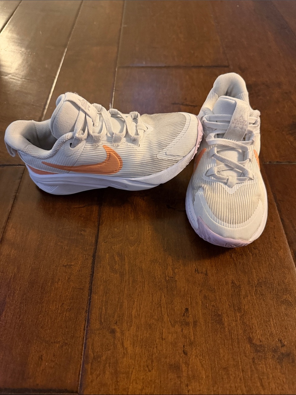 Nike Kids White Sneakers with Peach Swoosh